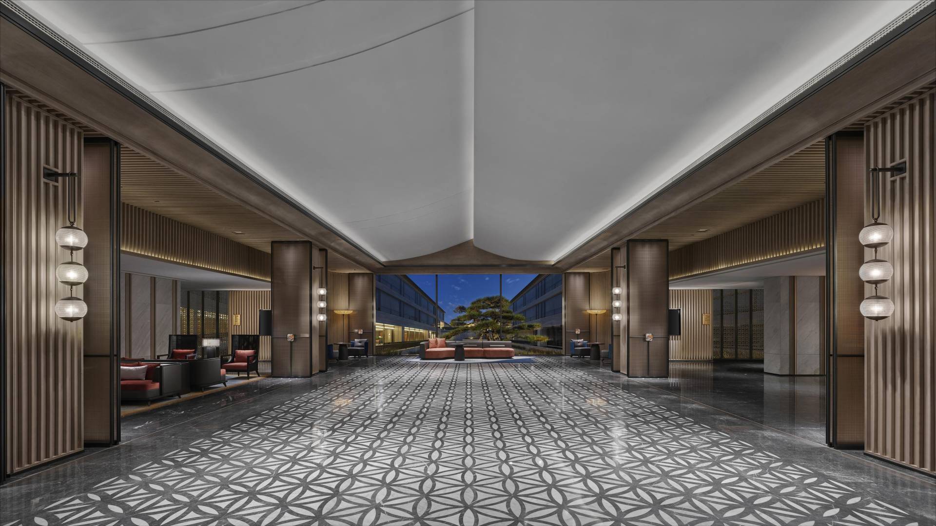 Lobby features patterned floor, sofas, modern lamps at Angsana Suzhou Shishan, luxury setting.